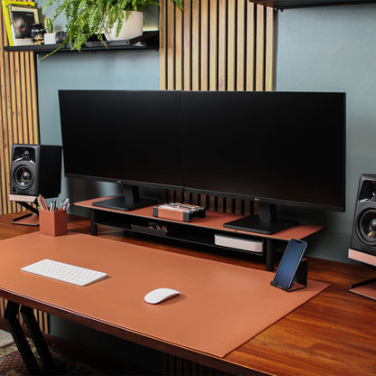 Brown Leather Desk mat on the wooden desk with other matching leather accessories 