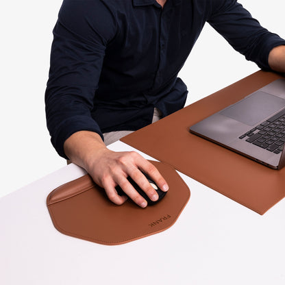 Human using Personalized Brown Mouse pad with wrist support under magic mouse 