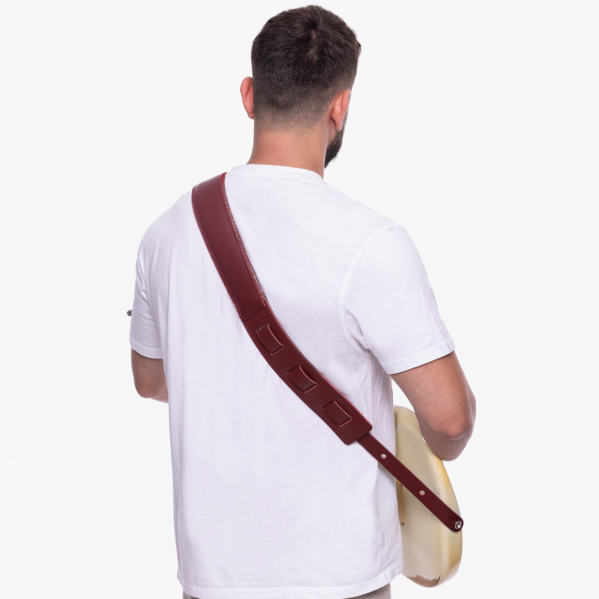 Red Padded Leather guitar strap on model #color_burgundy